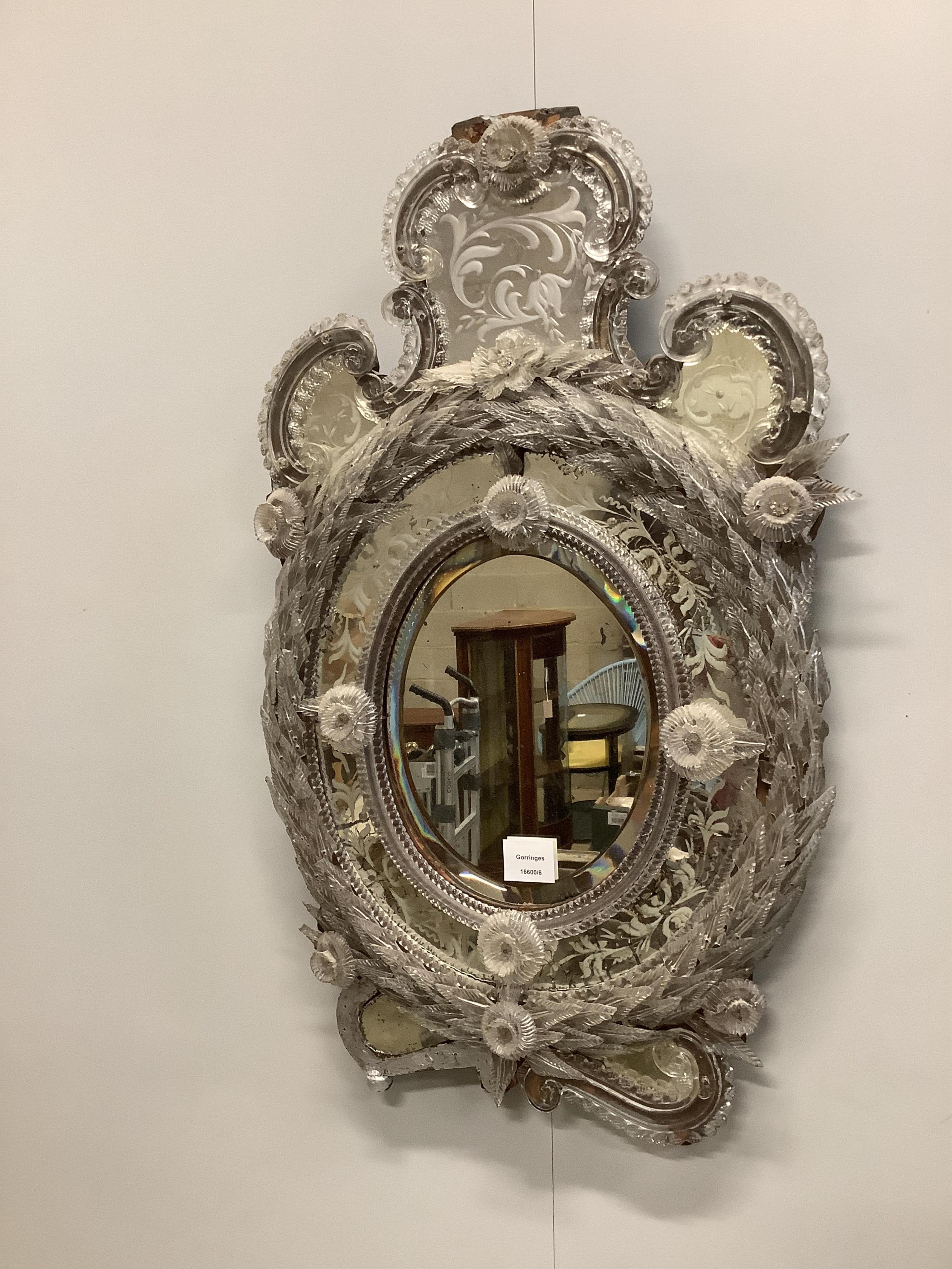 A Venetian wall mirror, width 47cm, height 74cm. Condition - poor to fair, losses to pediment and lower left side